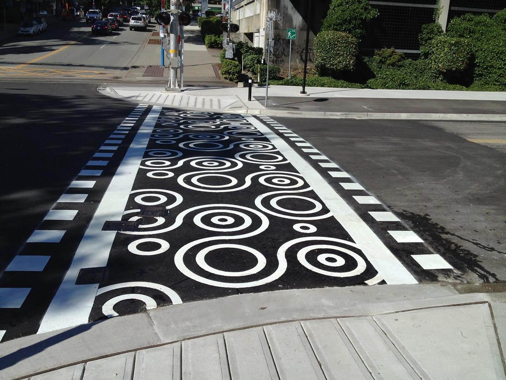 Community branding pavement graphics at a downtown streetscape in Canada — installed by HUB Surface Systems