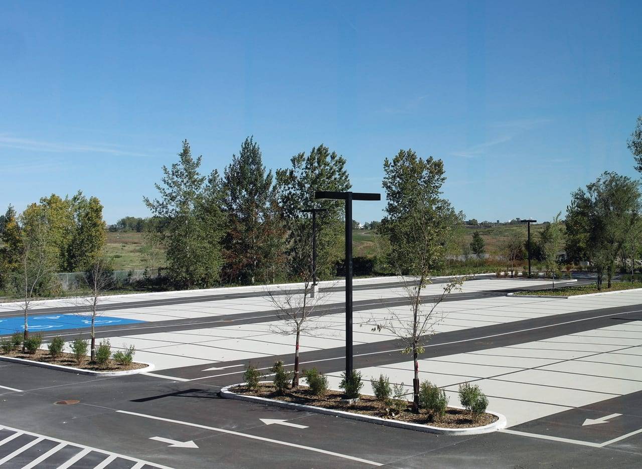 StreetBondSR solar-reflective coating specified for surface temperature reduction and LEED credit — a courtyard surface