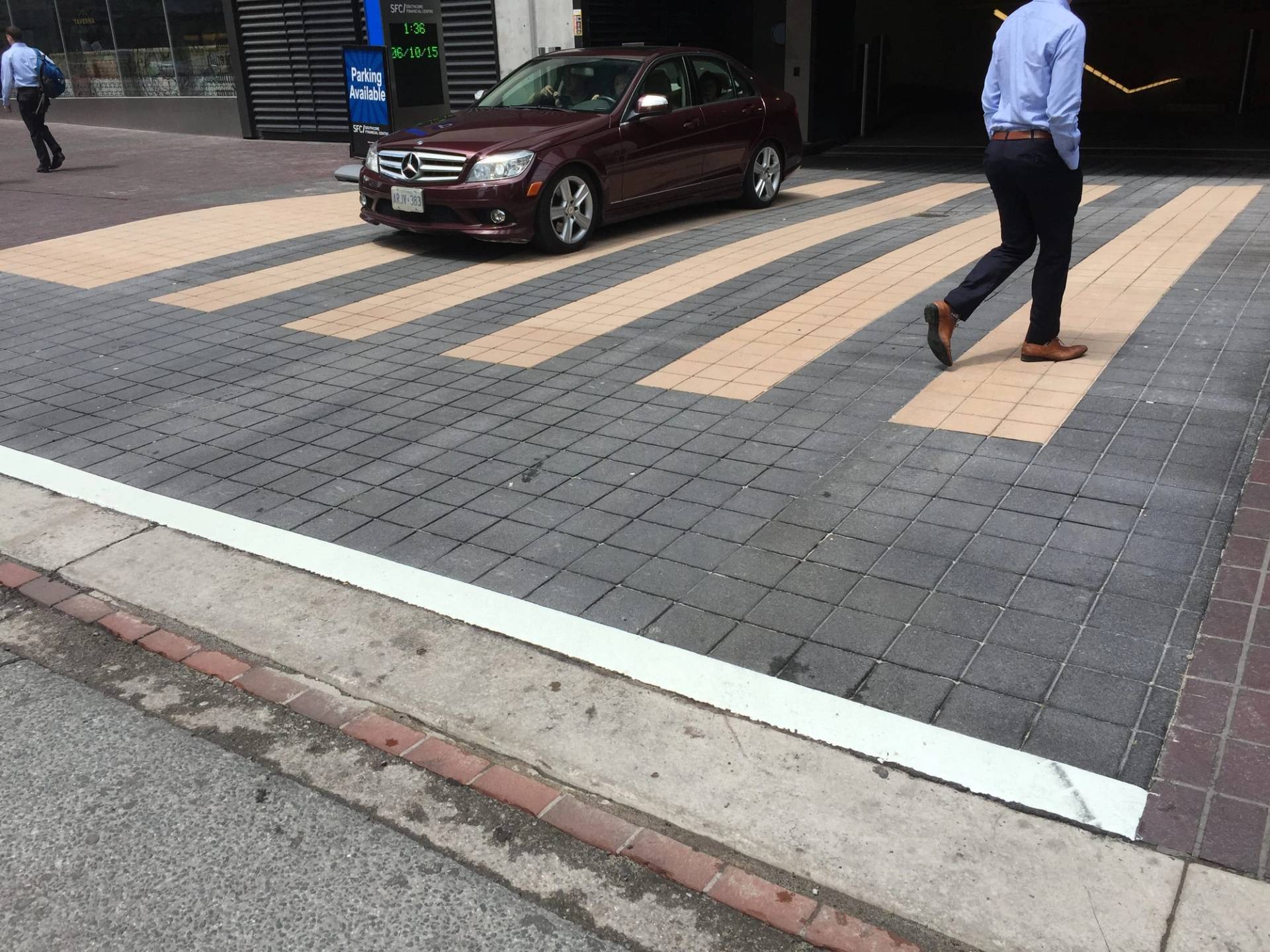 Decorative crosswalk installation in Canada: high-visibility pedestrian crossing at a municipal intersection