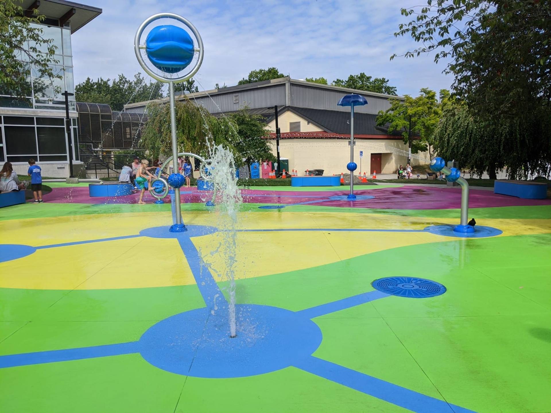 Splash pad surfacing at a community water play area in Canada, installed by HUB Surface Systems