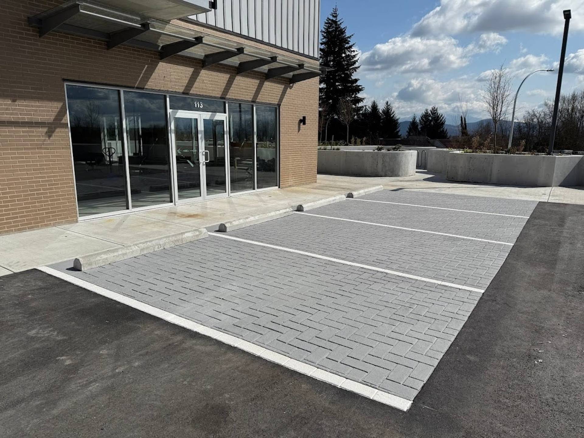 Commercial pavement design specified for retail entrances and commercial site identity at a retail plaza entrance