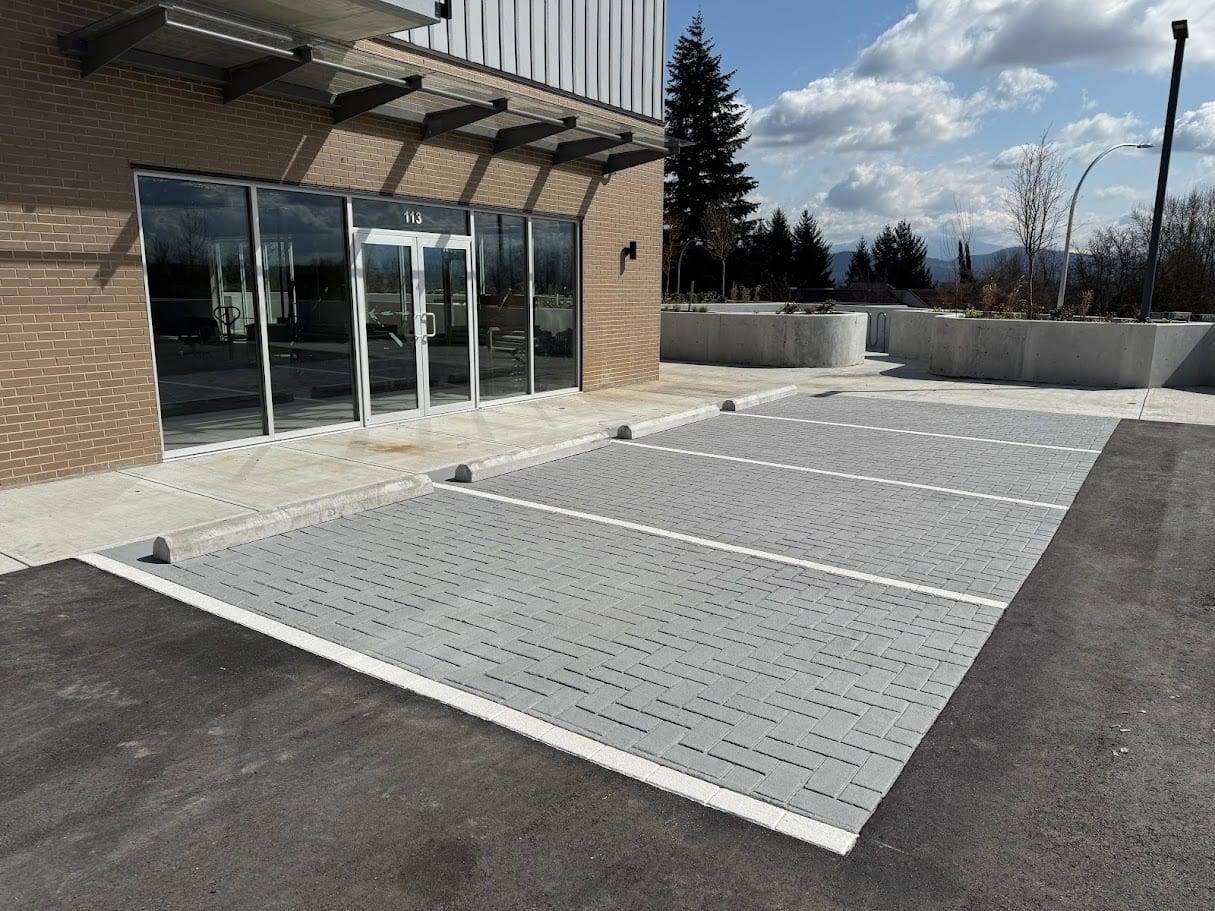 Commercial pavement design specified for retail entrances and commercial site identity at a retail plaza entrance