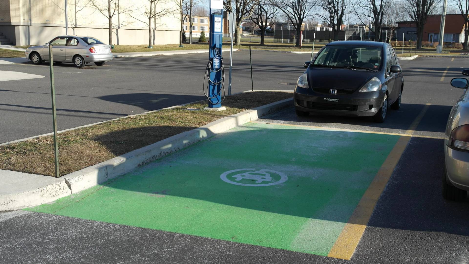 Parking lot line marking installation in Canada: stall layout and accessible parking at a grocery anchor site