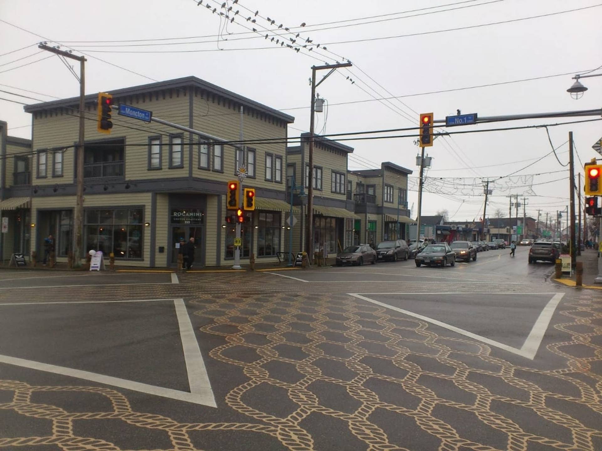 DuraTherm inlaid thermoplastic in preformed thermoplastic inlaid flush with the asphalt at a crosswalk, Canada