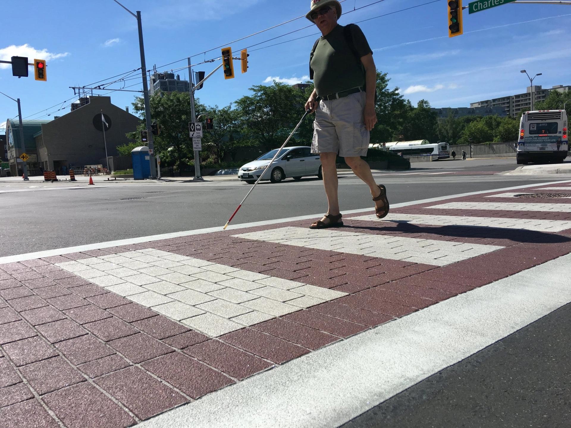 Decorative crosswalk specified for high-visibility pedestrian crossing at a signalized urban intersection