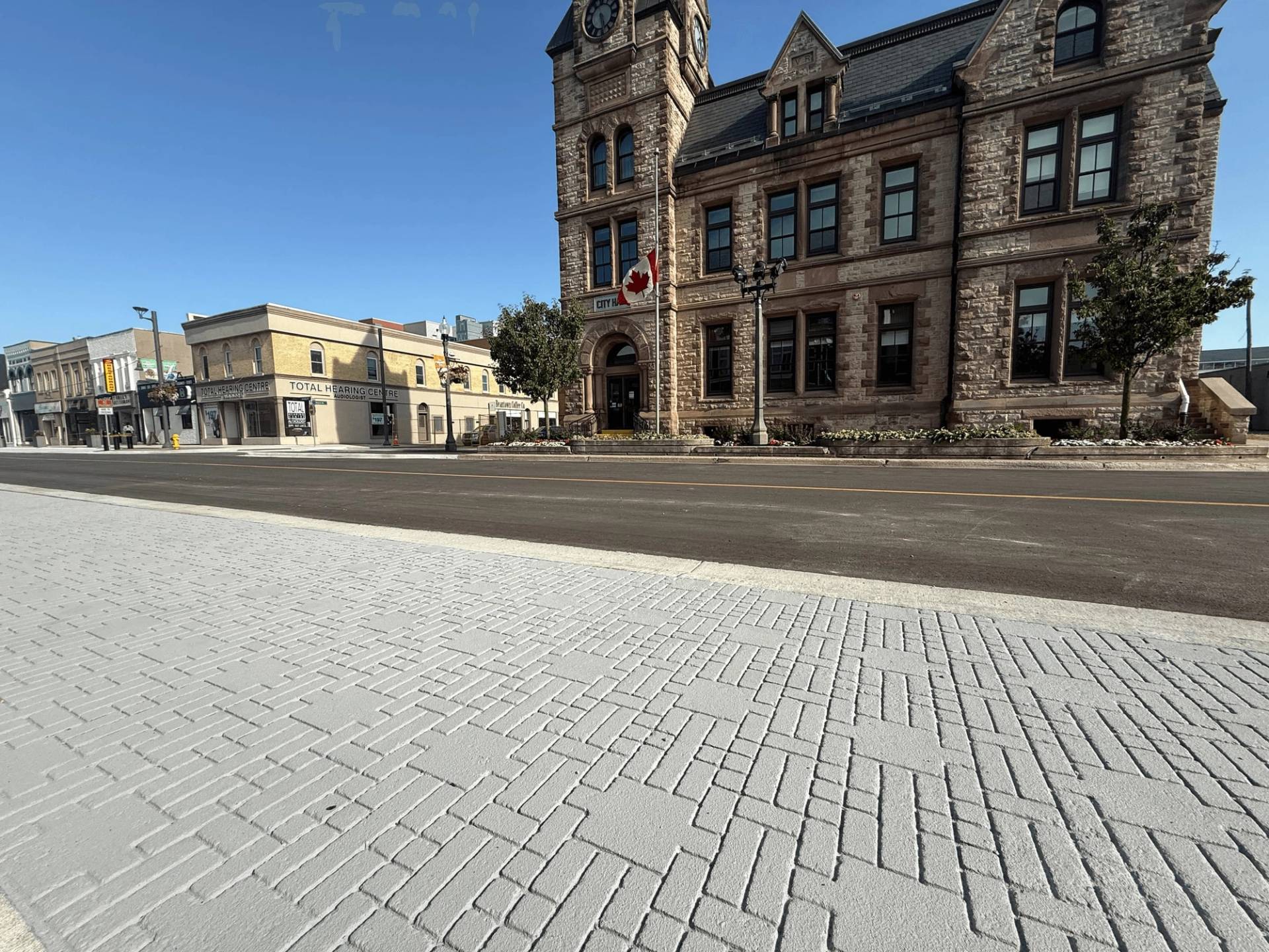 StreetPrint stamped asphalt installation in Canada: brick and cobblestone appearance in asphalt at a plaza