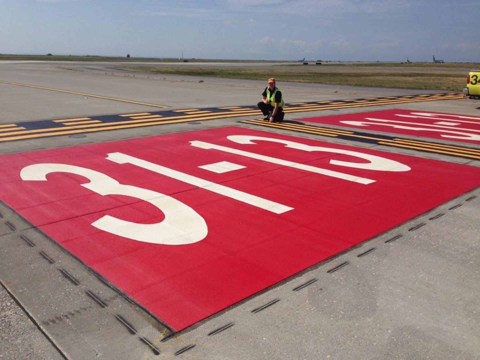 AirMark airfield pavement marking in preformed thermoplastic airfield marking at an airside road, Canada