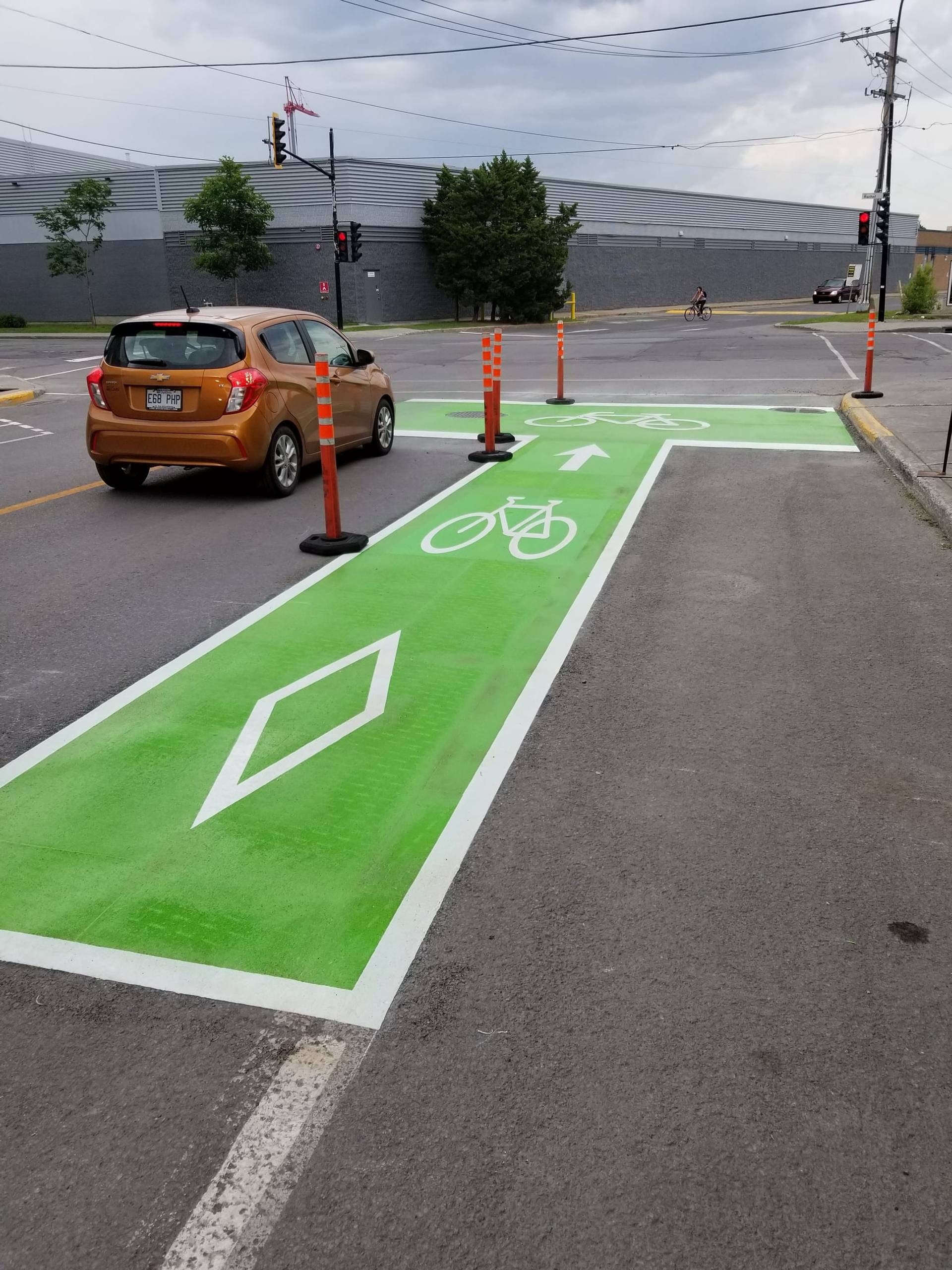 Coloured bike lane specified for protected cycling infrastructure at an intersection conflict zone