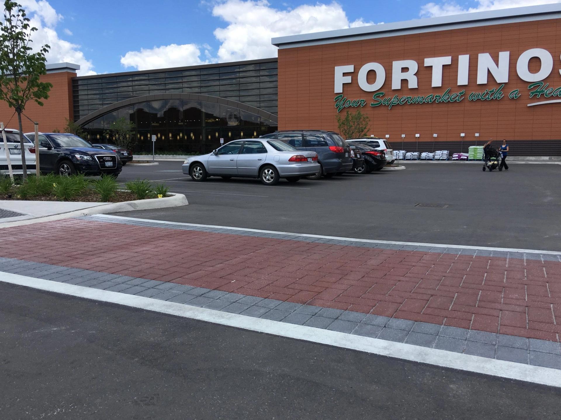 HUB Surface Systems decorative crosswalk — high-visibility pedestrian crossing at a residential collector road