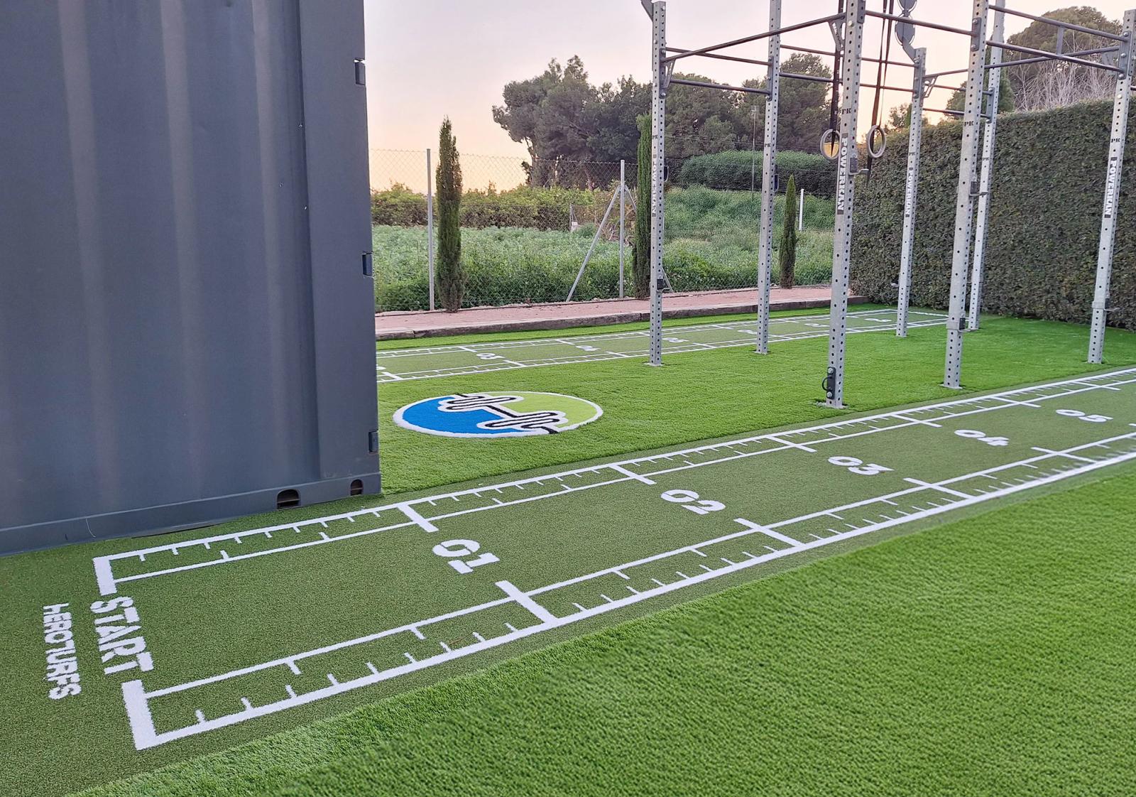 The AV Sana crest set into the centre of the green training lanes