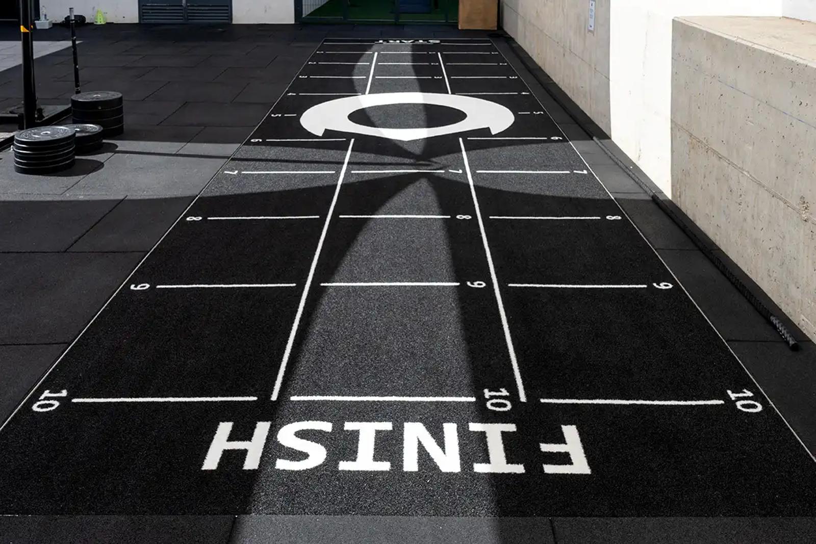 The full black sled track running through Oxygen Sports & Wellness Club, Málaga