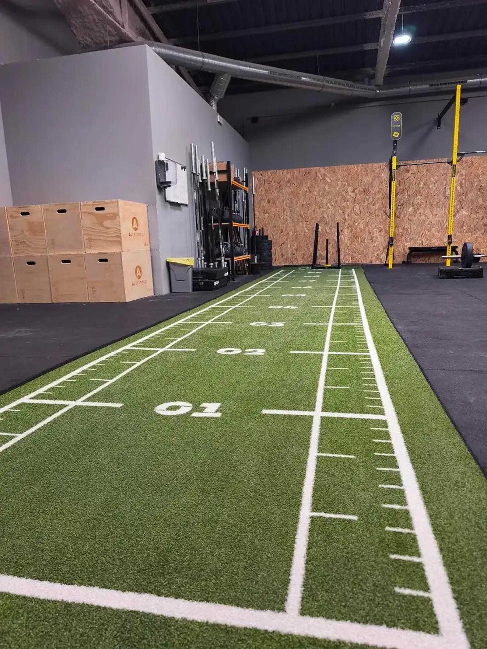Turf sled track crossing the functional training area of the Boxcelona box in Barcelona