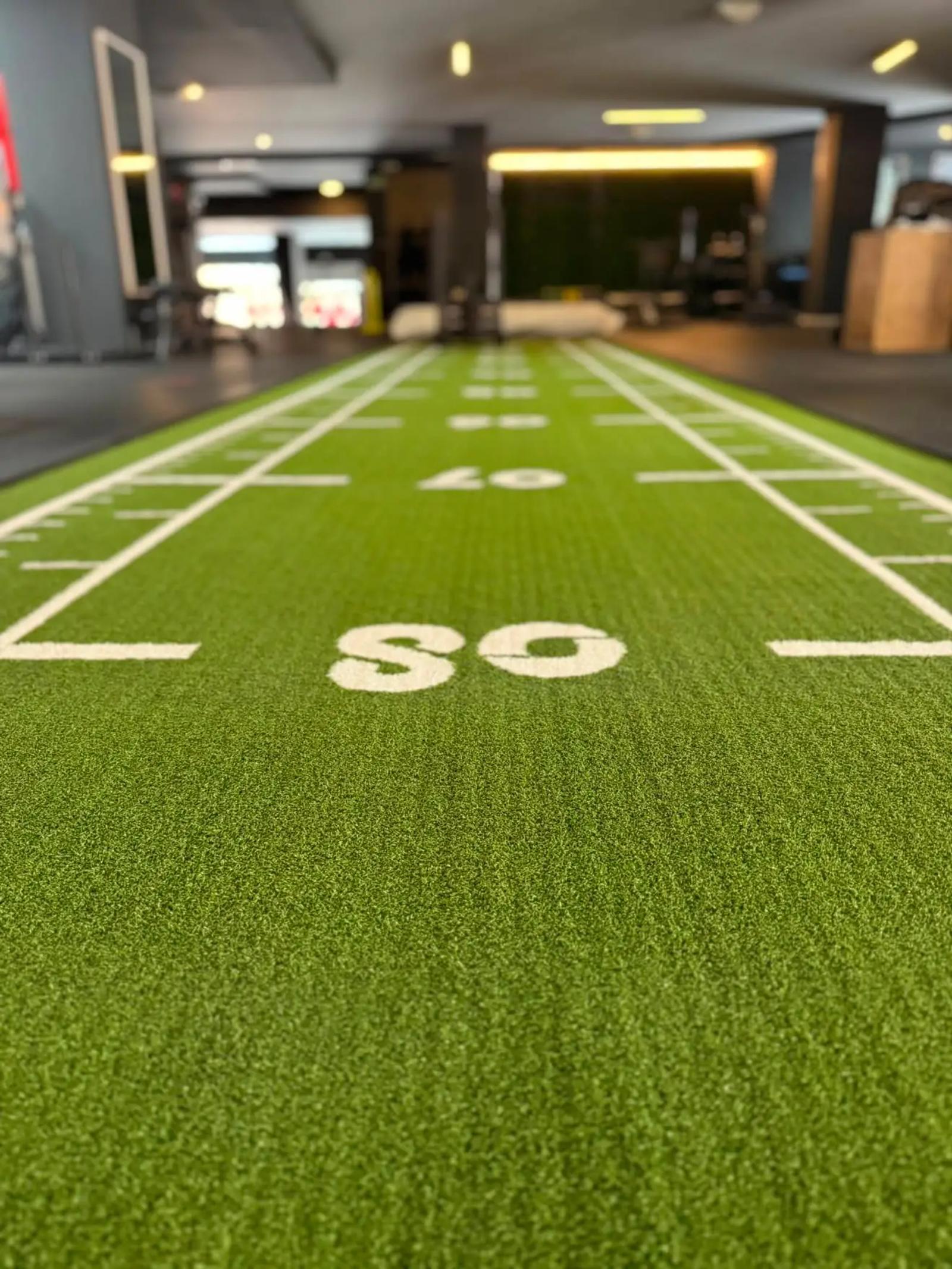 Green Elysium sled track on the training floor at Wellness Studio Training Club, Badajoz
