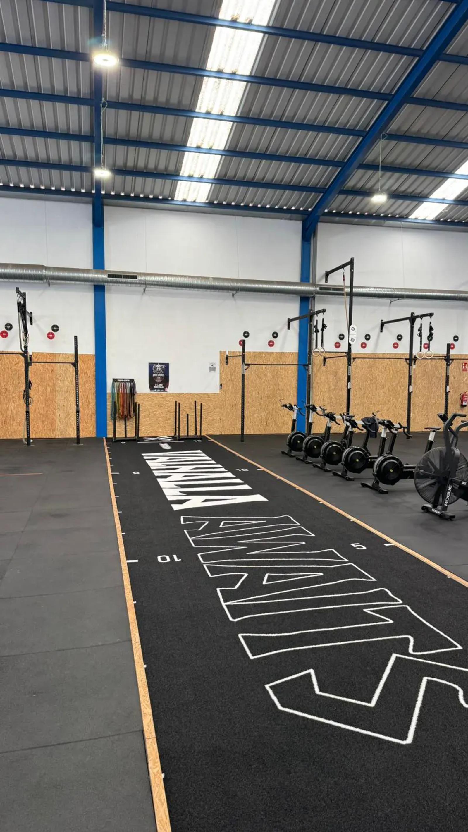 Side view of the black Valhalla track with the club's branding, Midgard Crosstraining Club