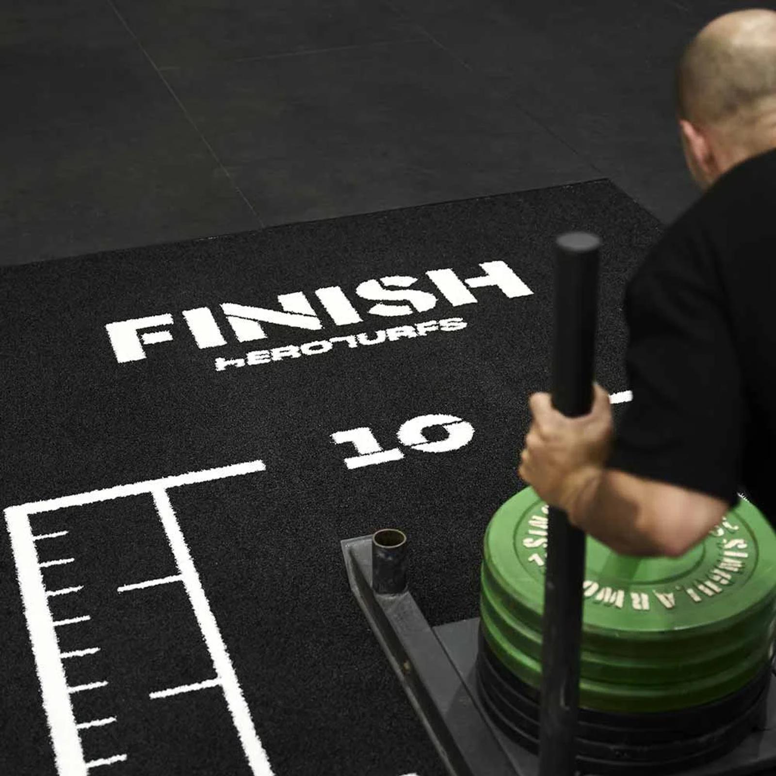Detail of the FINISH line and lane markings on the black training track
