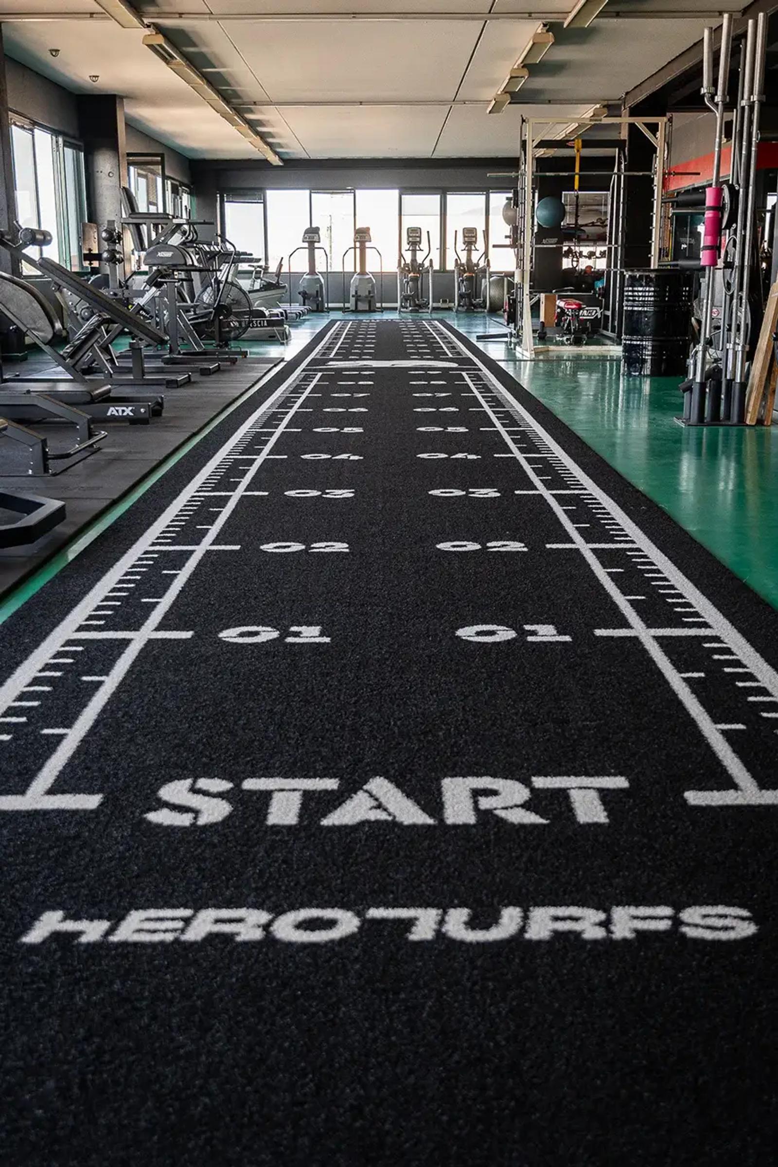 White START marking on the black turf lane at Move Brescia, Bedizzole, Italy