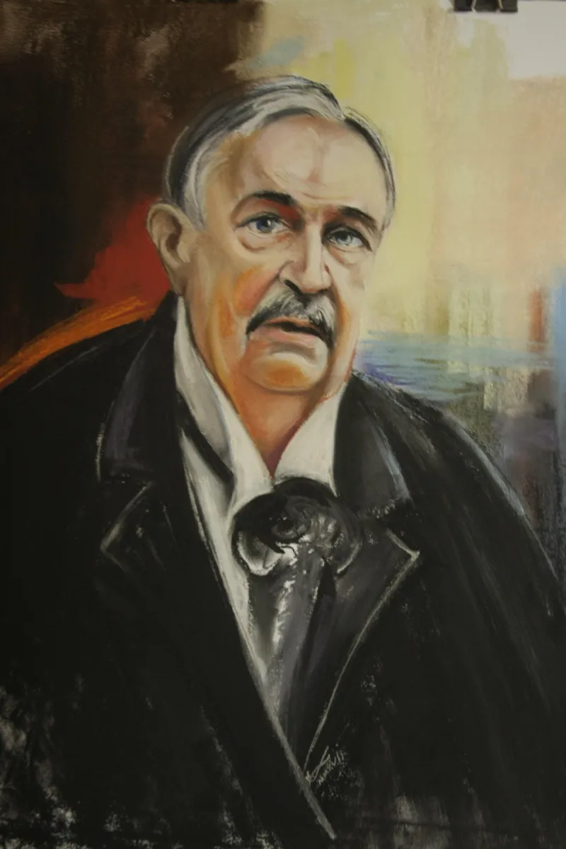 Barwny portret mężczyzny z wąsami, w ciemnej marynarce i krawacie.