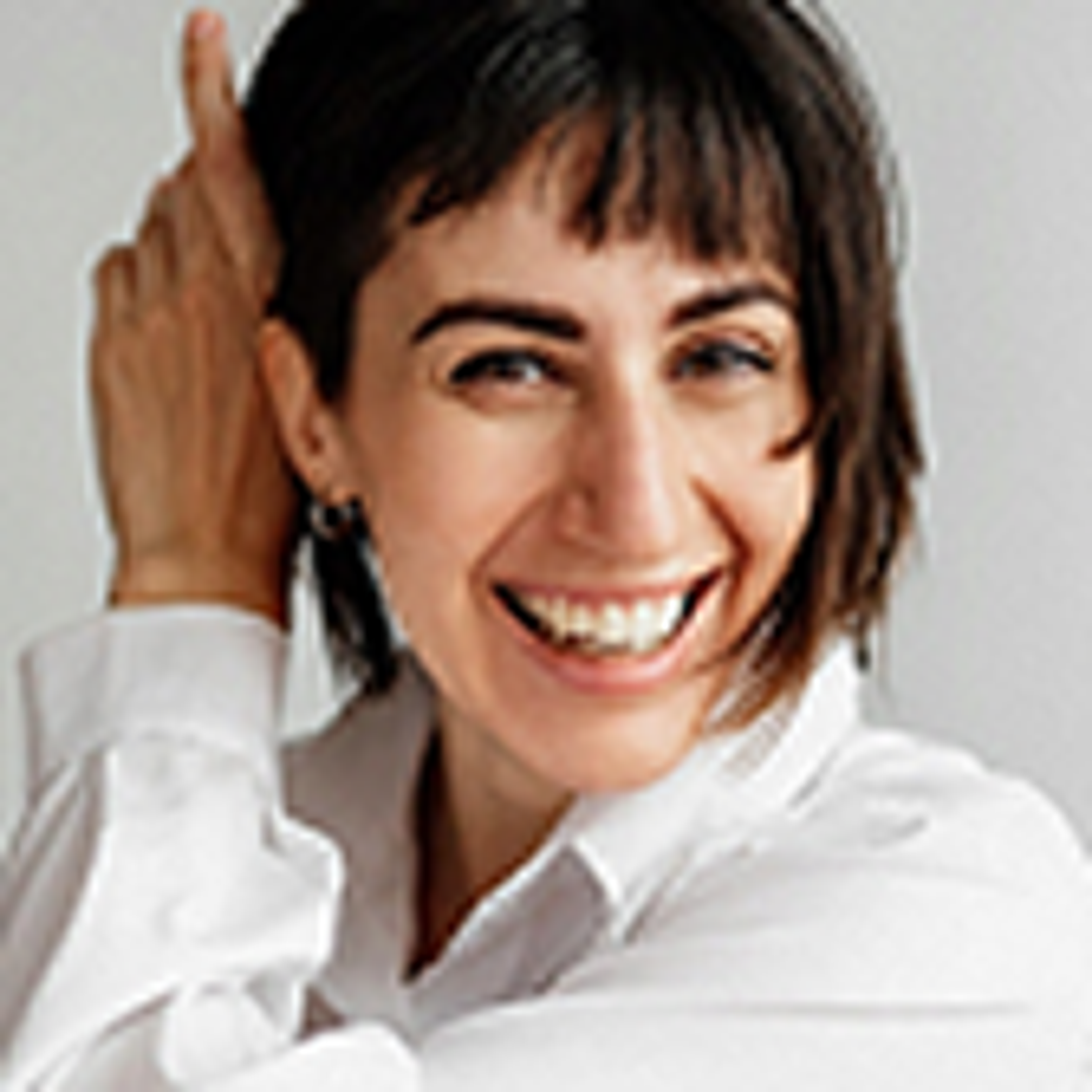 Portrait of Marina Shim, smiling, in a white shirt