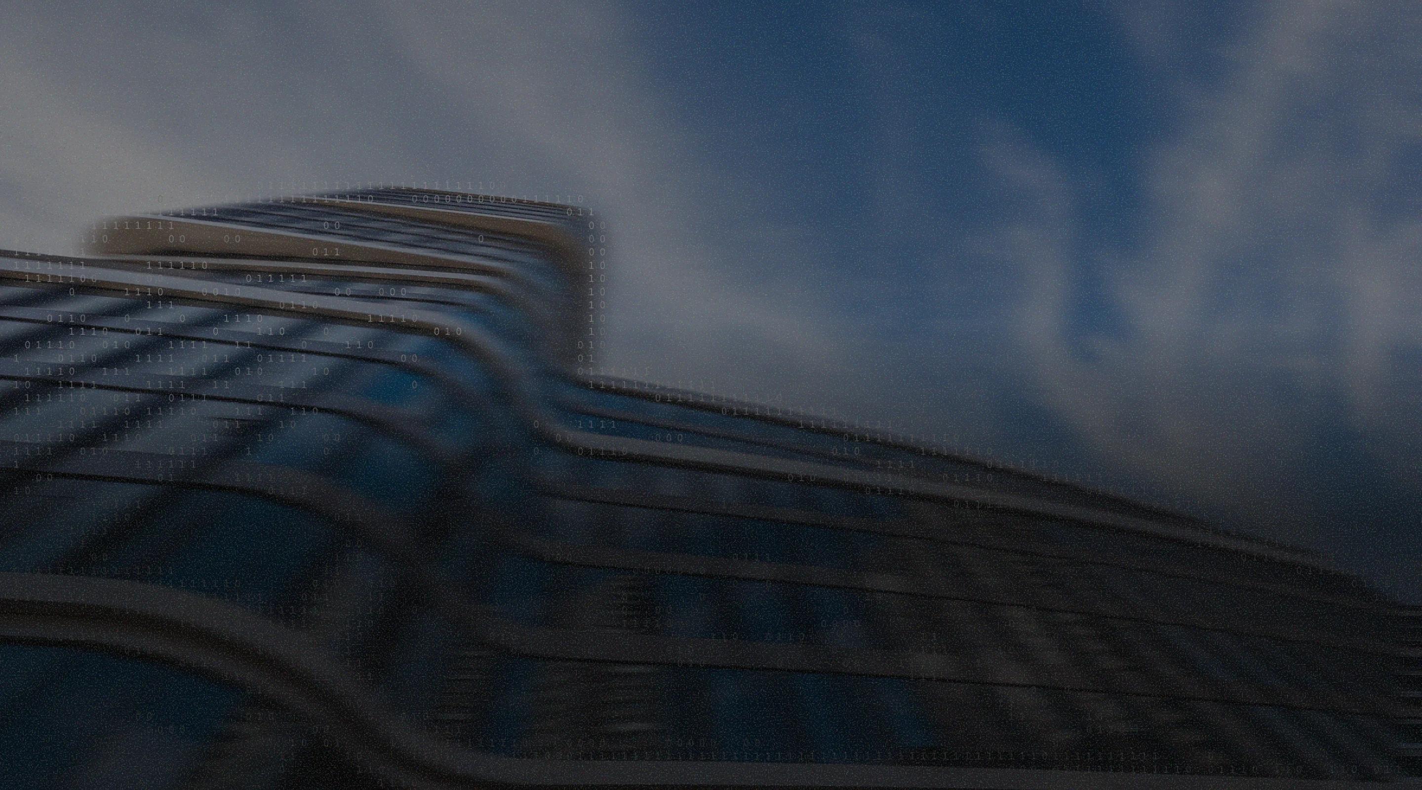 Low-angle, motion-blurred view of a curved glass skyscraper