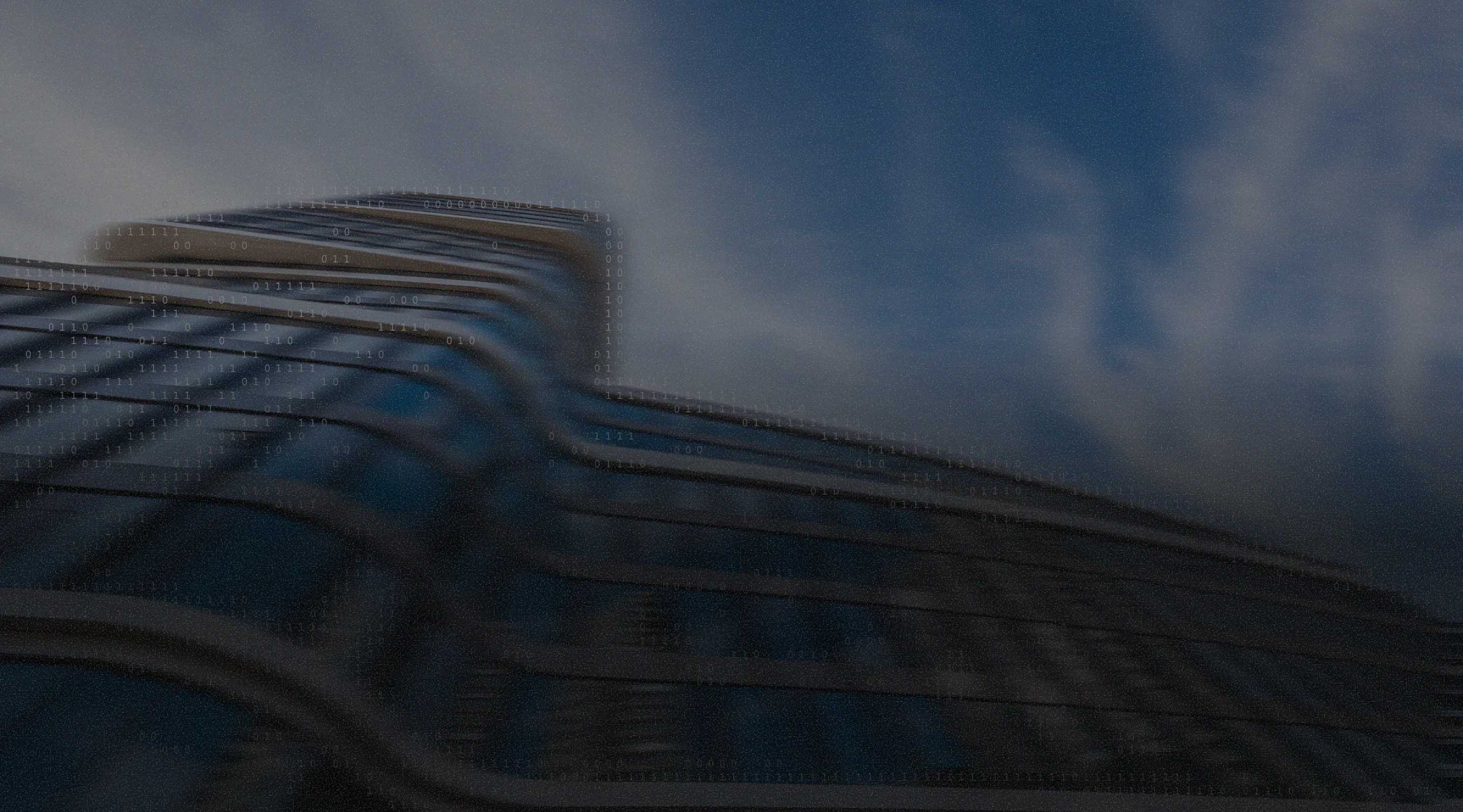 Low-angle, motion-blurred view of a curved glass skyscraper