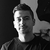 Portrait of Marco Dvorak in a black t-shirt