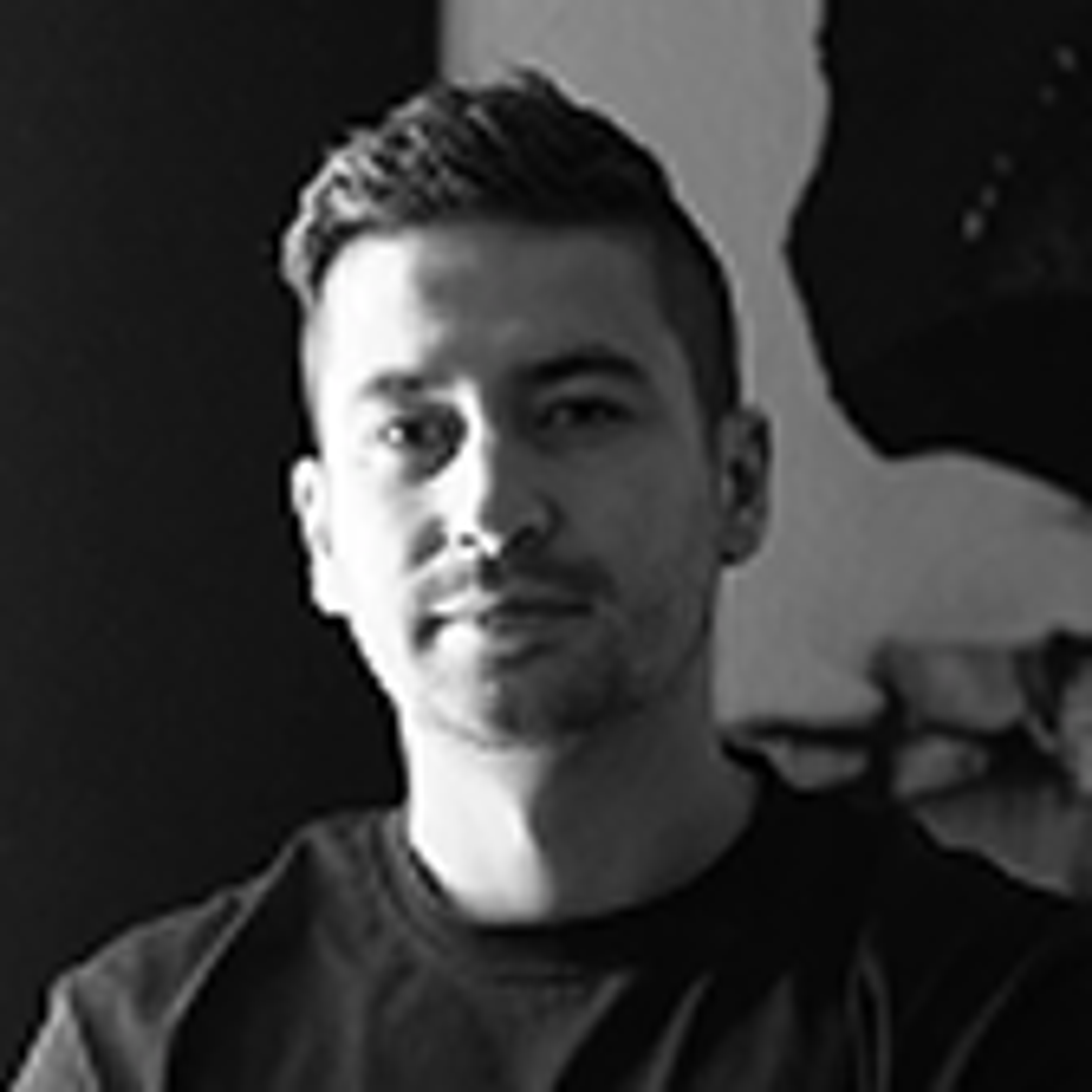 Portrait of Marco Dvorak in a black t-shirt