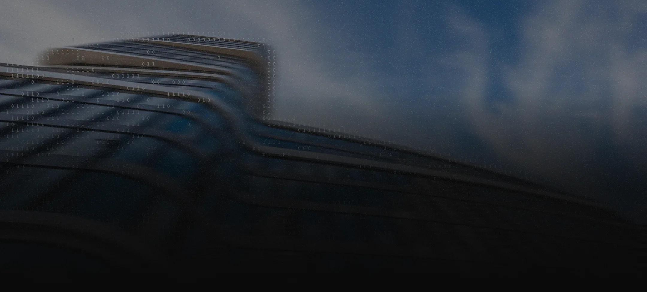 Low-angle, motion-blurred view of a curved glass skyscraper
