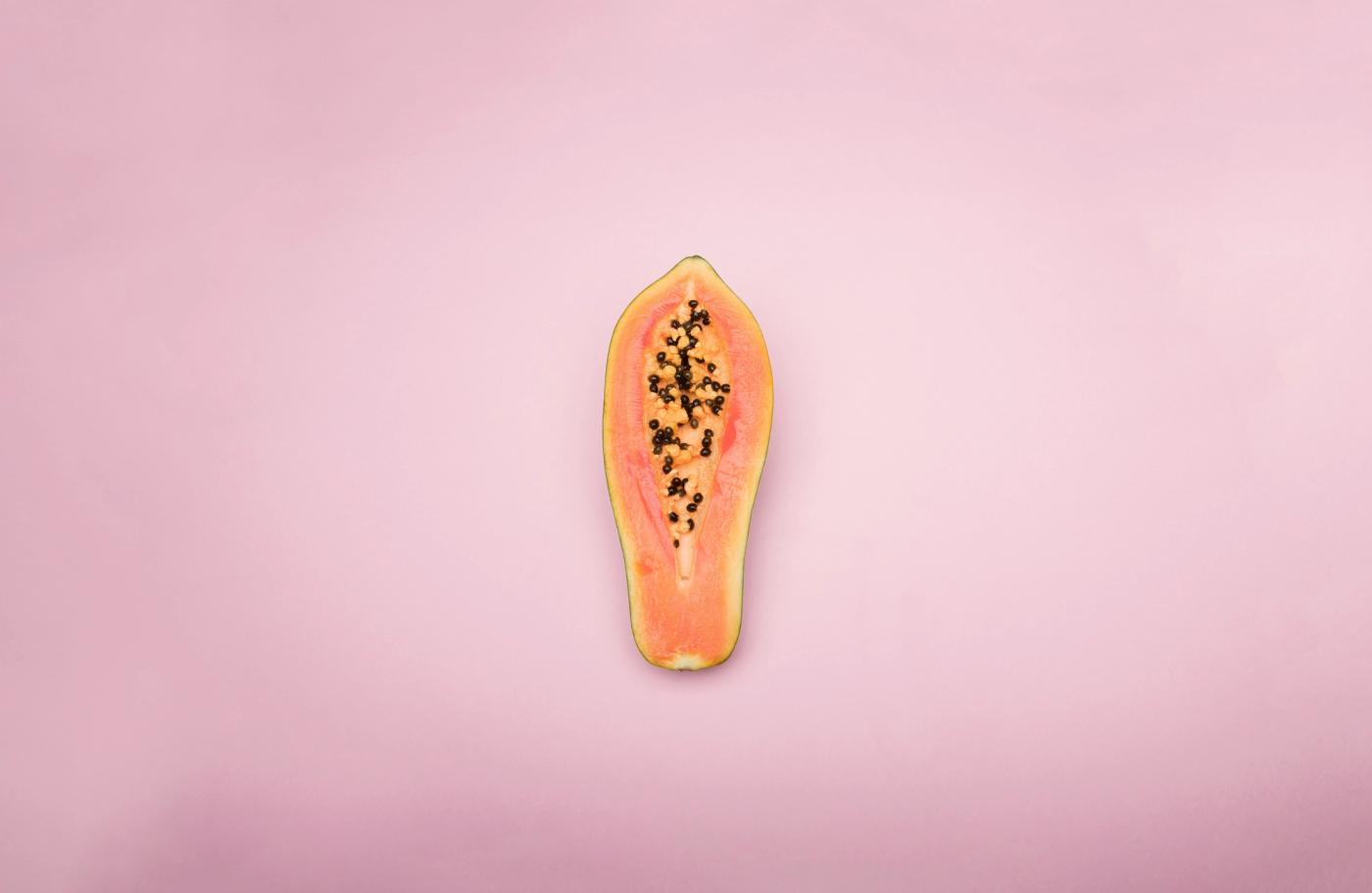 Papaya on pink background