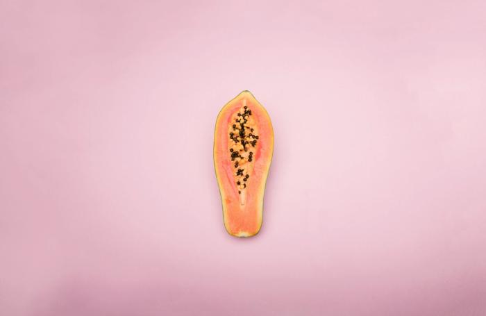 Papaya on pink background