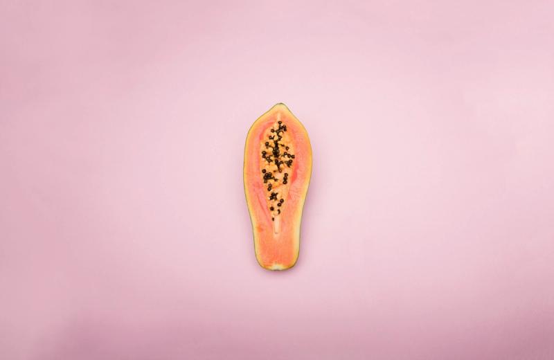 Papaya on pink background