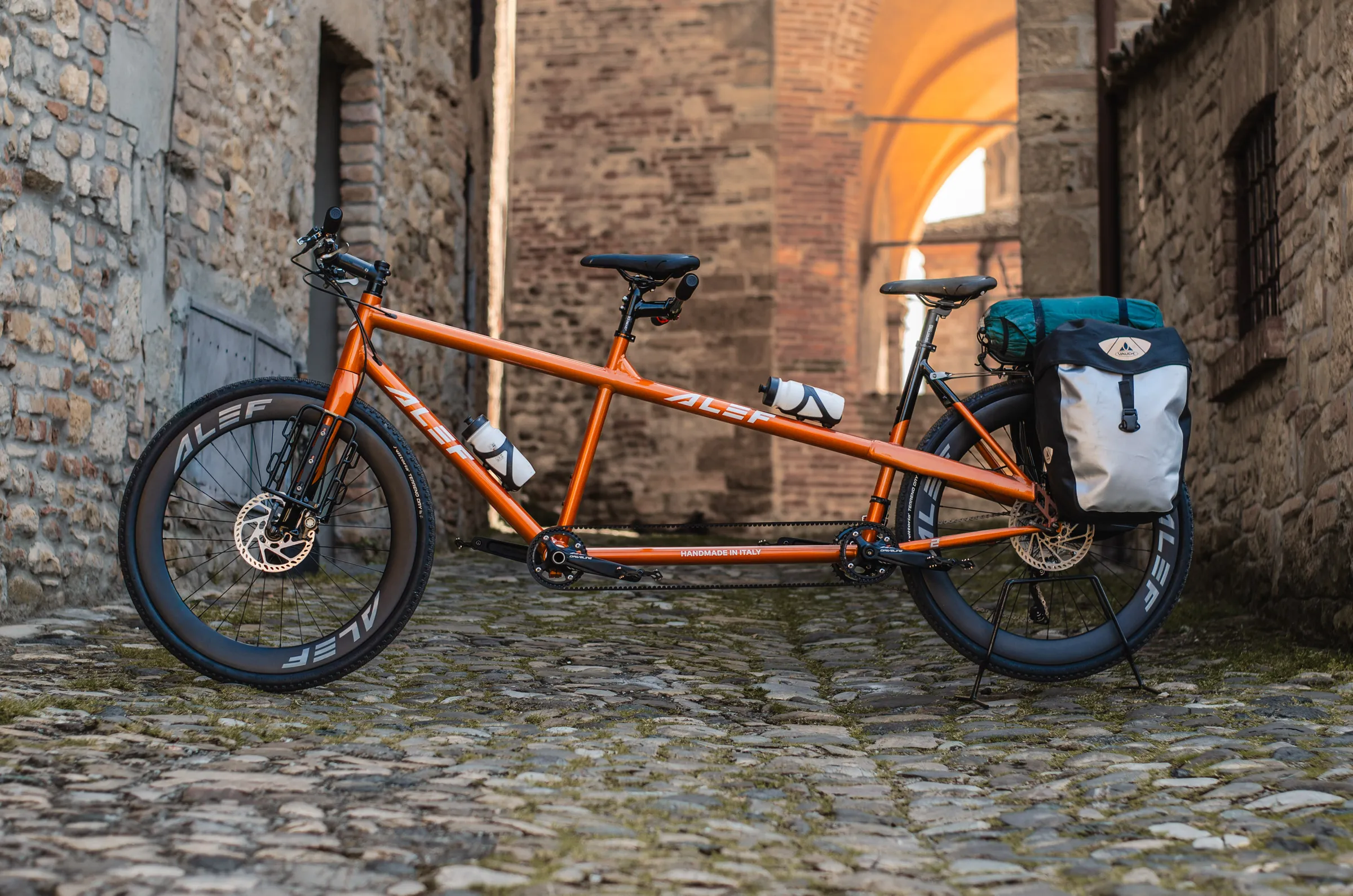 Touring tandem with bags inside an italian medieval village