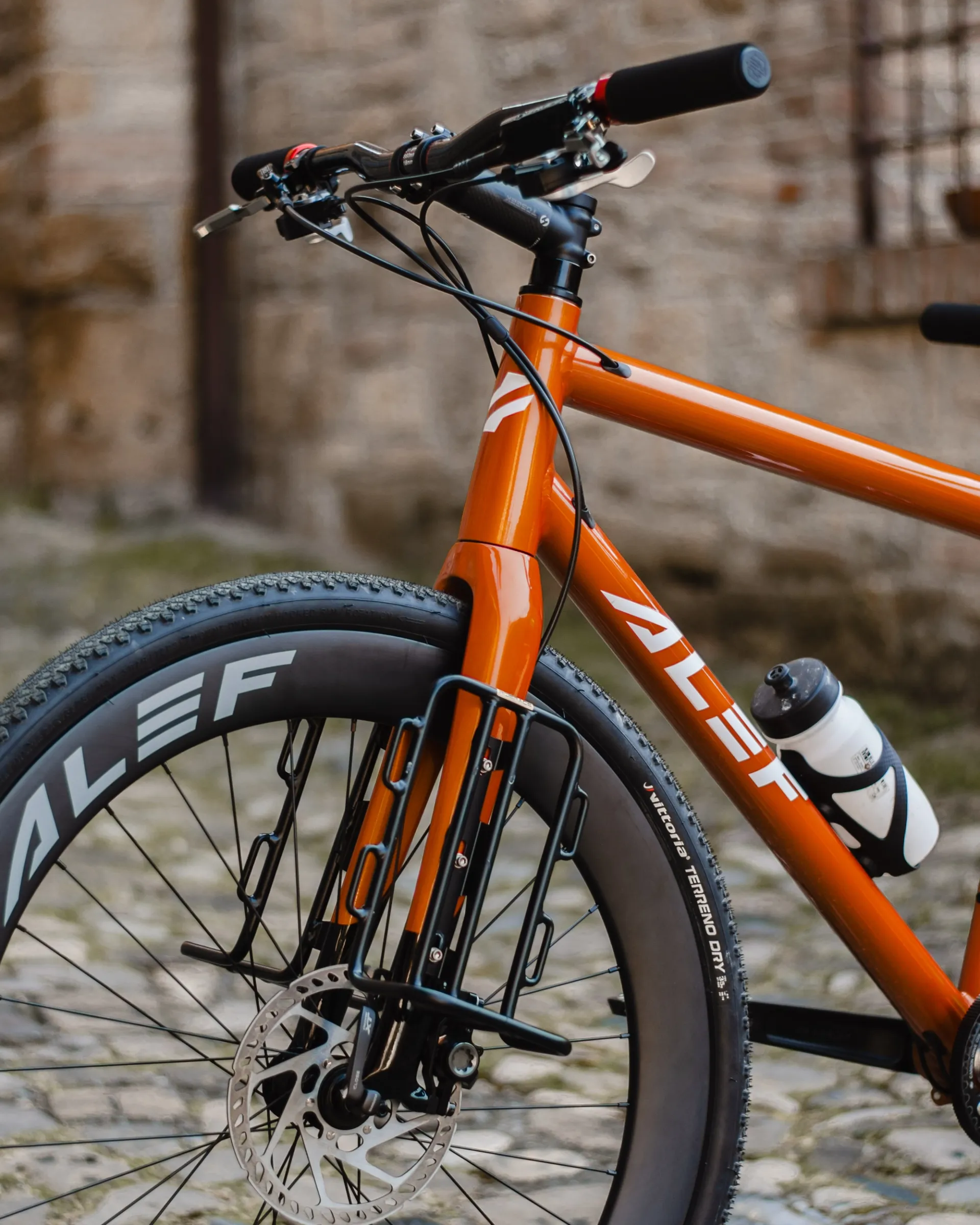 Touring tandem inside an italian medieval village, front view