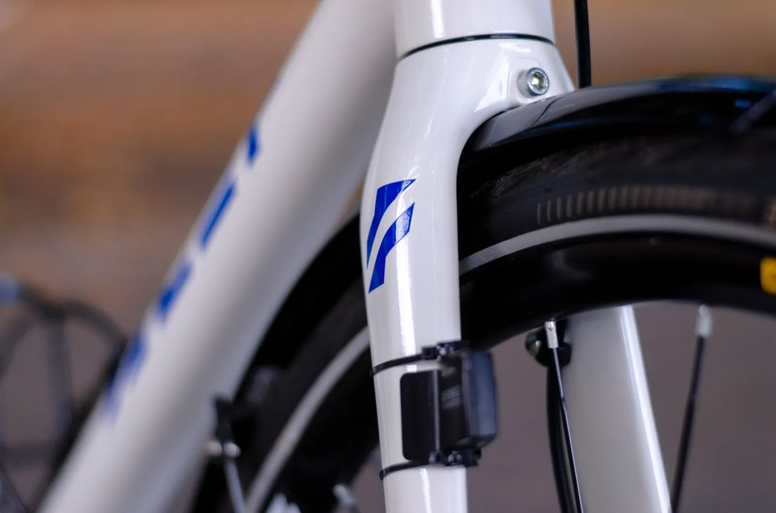 Alef logo on white fork of Alef's gravel bike