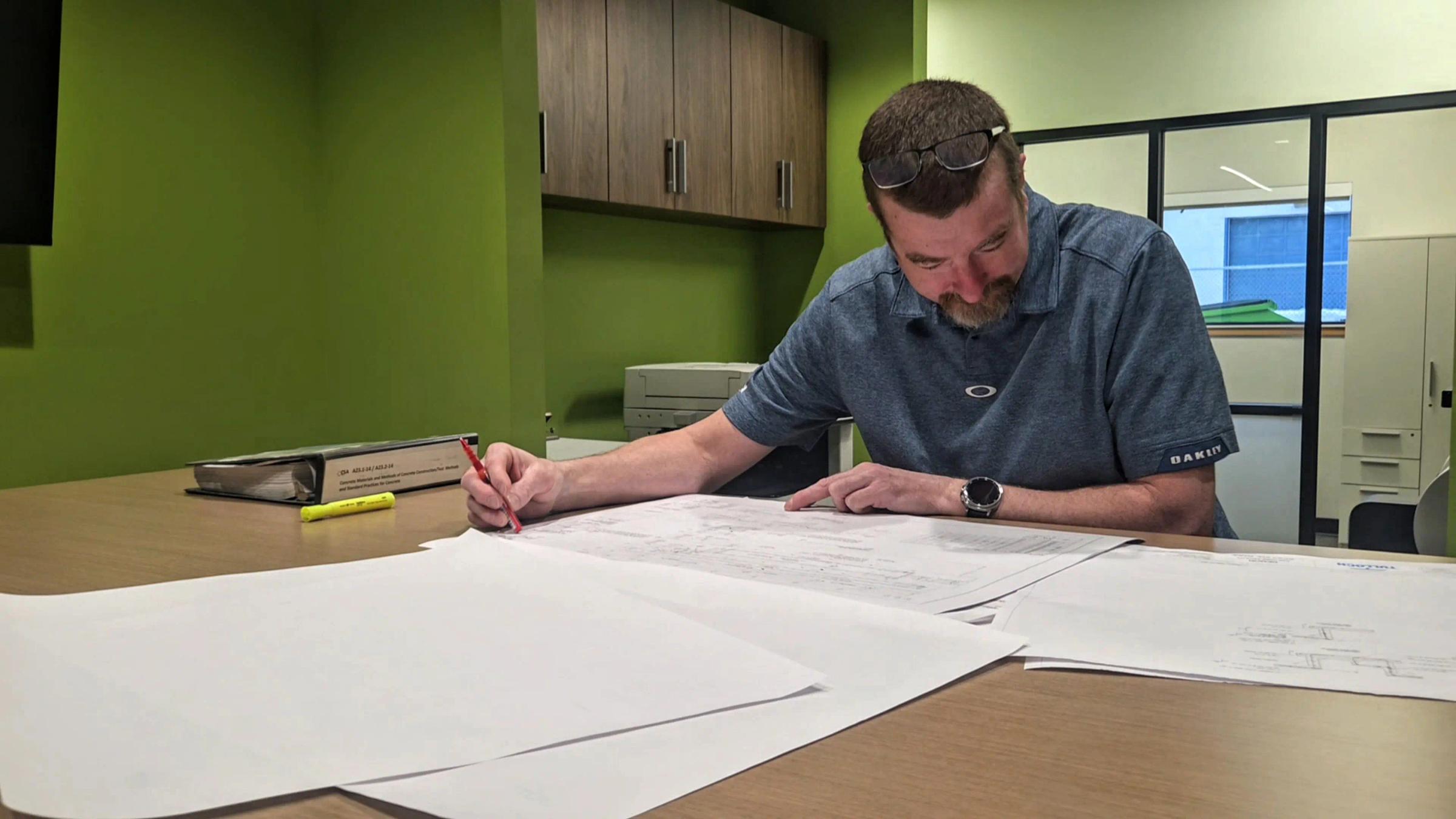 Sault Ste. Marie structural engineer reviewing drawings.