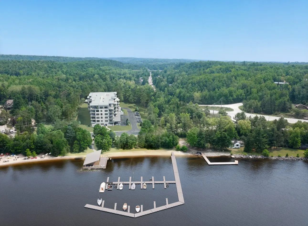 East aerial rendering of a waterfront development with docks and surrounding landscape.