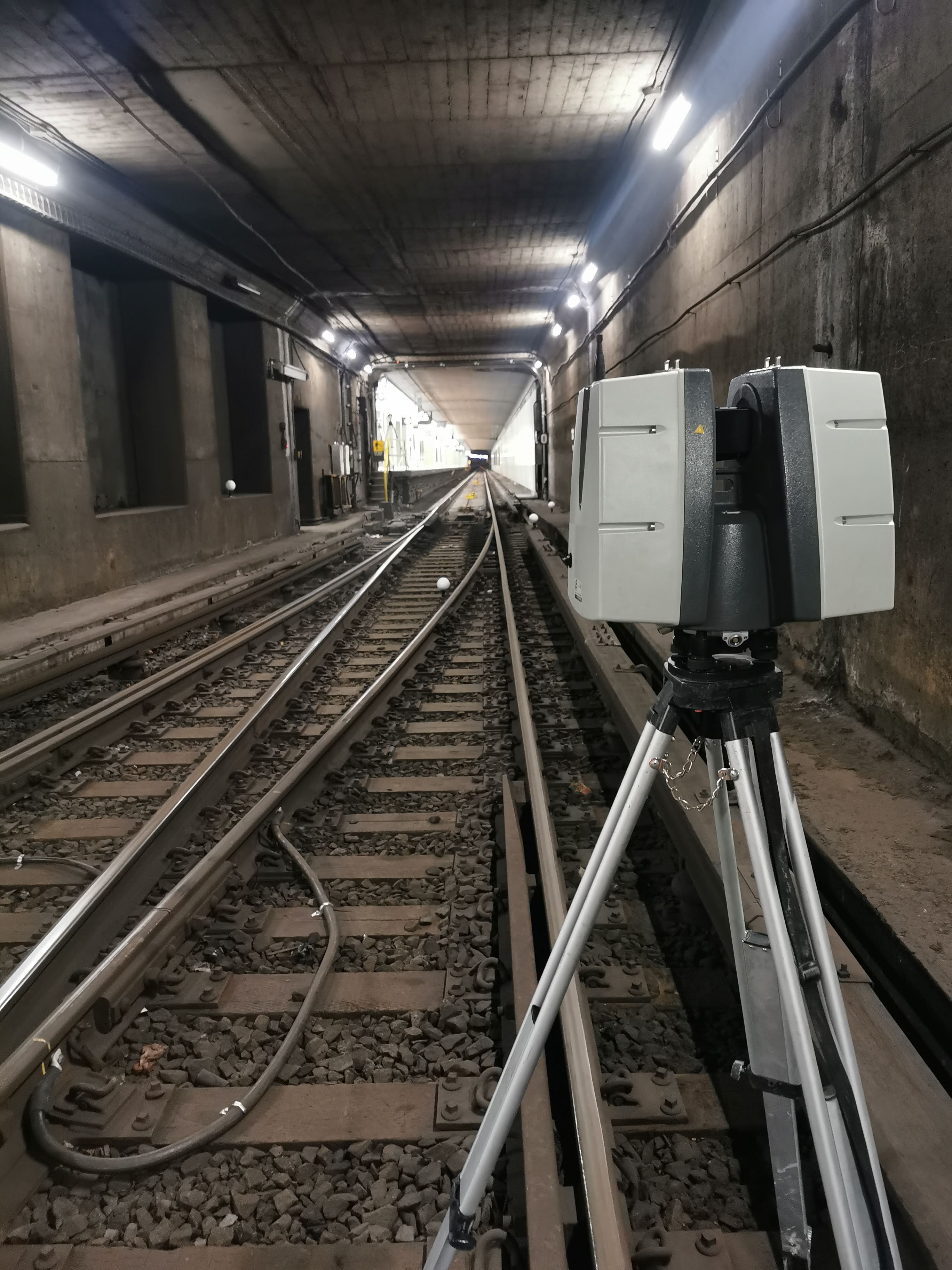 Static LiDAR scanner collecting data inside a rail tunnel at Union Station.