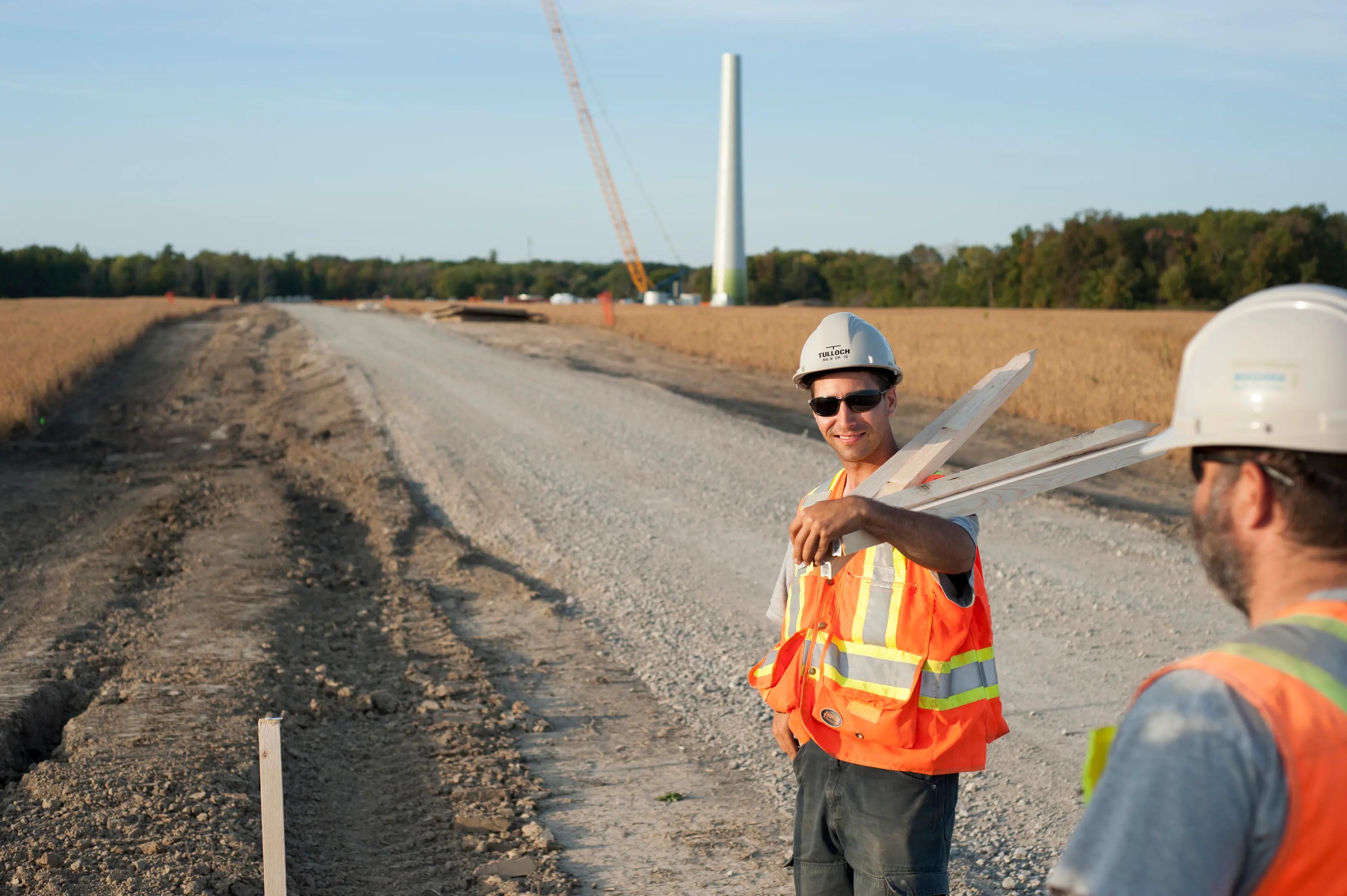 TULLOCH field technicians working along a wind farm access road.