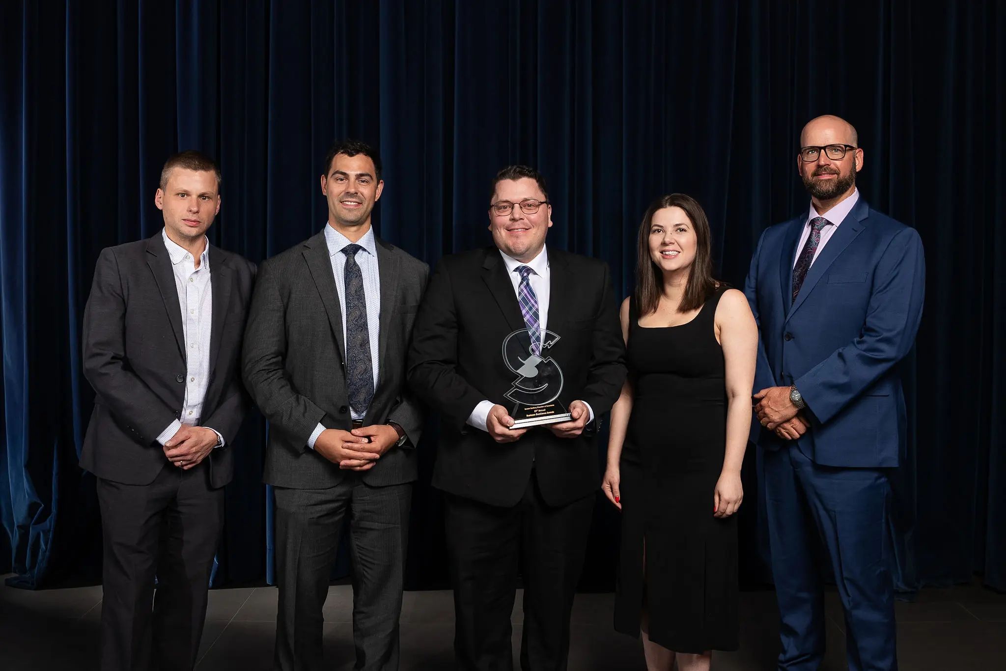 Accepting Bell Business Award for Company of the Year in Sudbury.