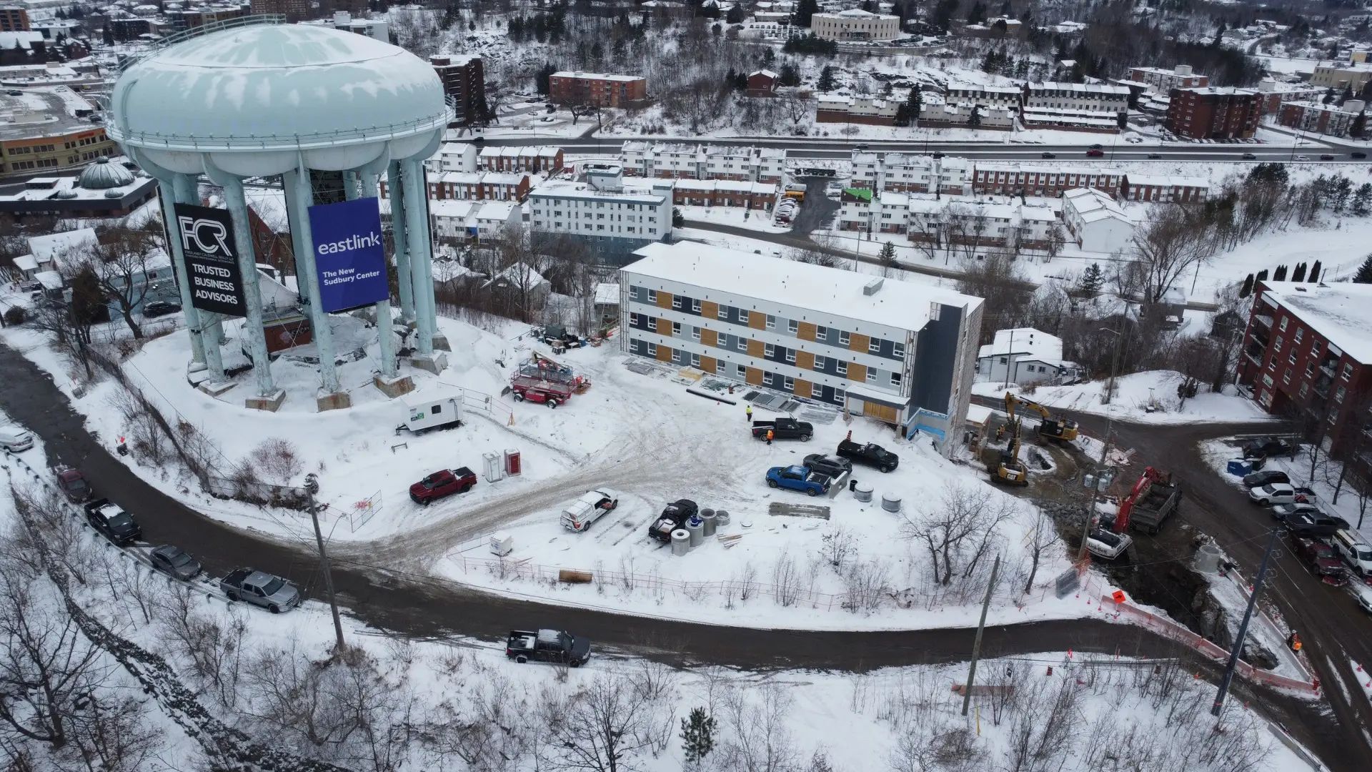 Aerial view of the Peace Tower and adjacent site in winter.