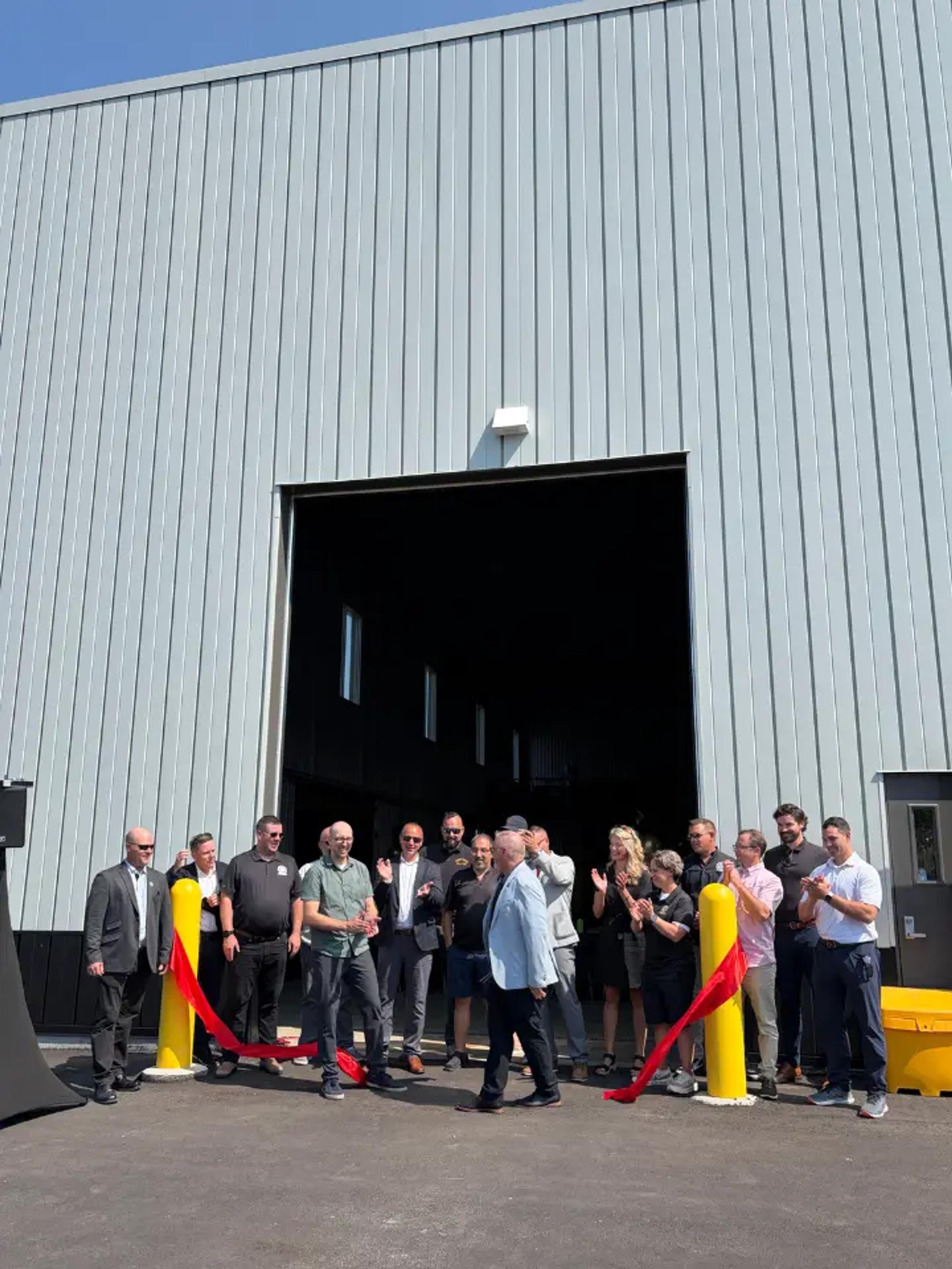 Group gathered for a ribbon-cutting ceremony outside the Boilermakers Union Hall.