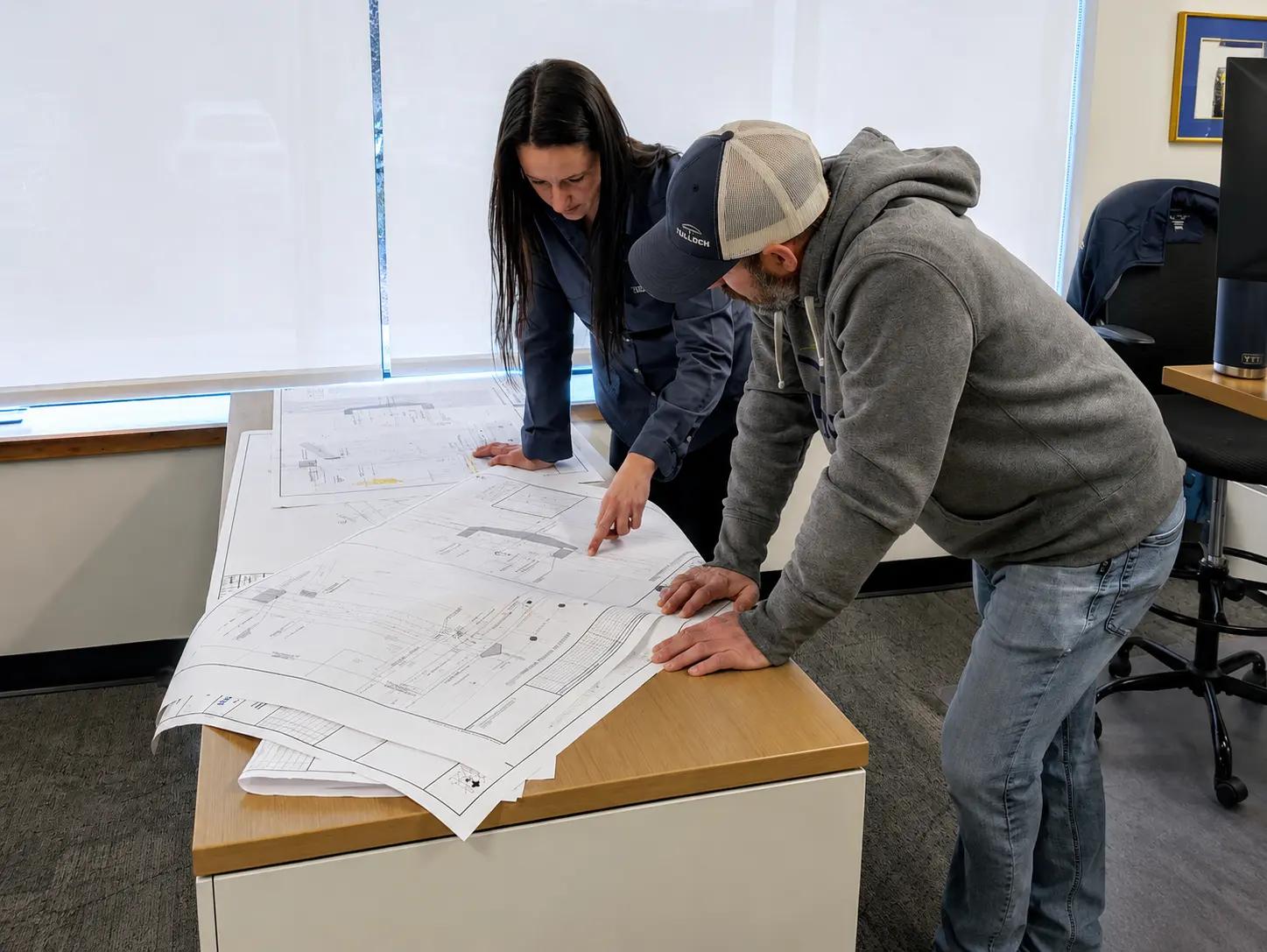 Designers looking at drawings in Sault Ste. Marie.