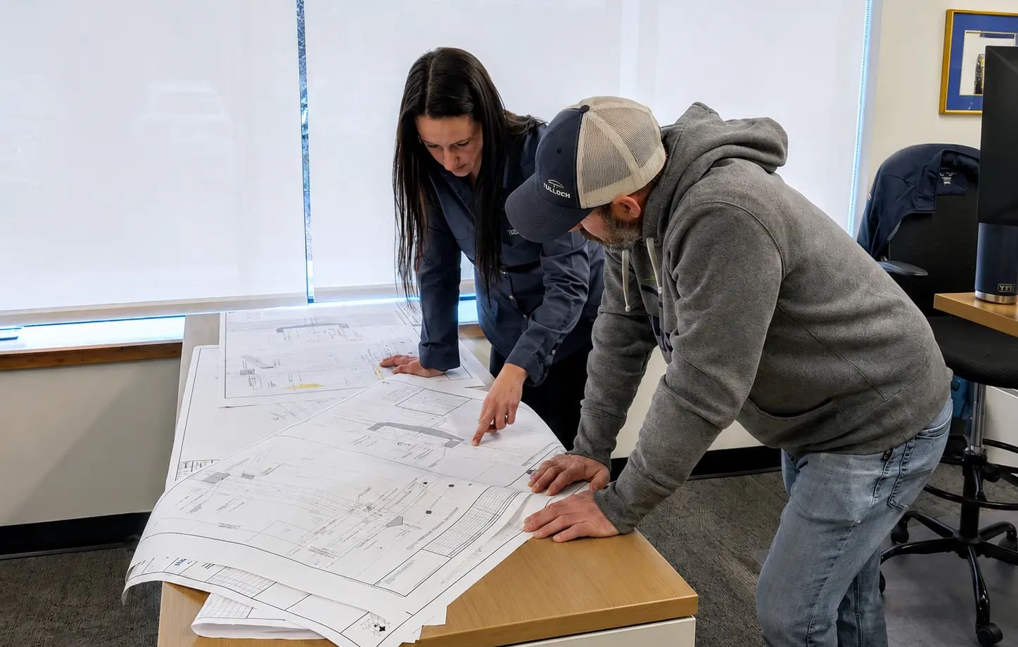 Designers looking at drawings in Sault Ste. Marie.