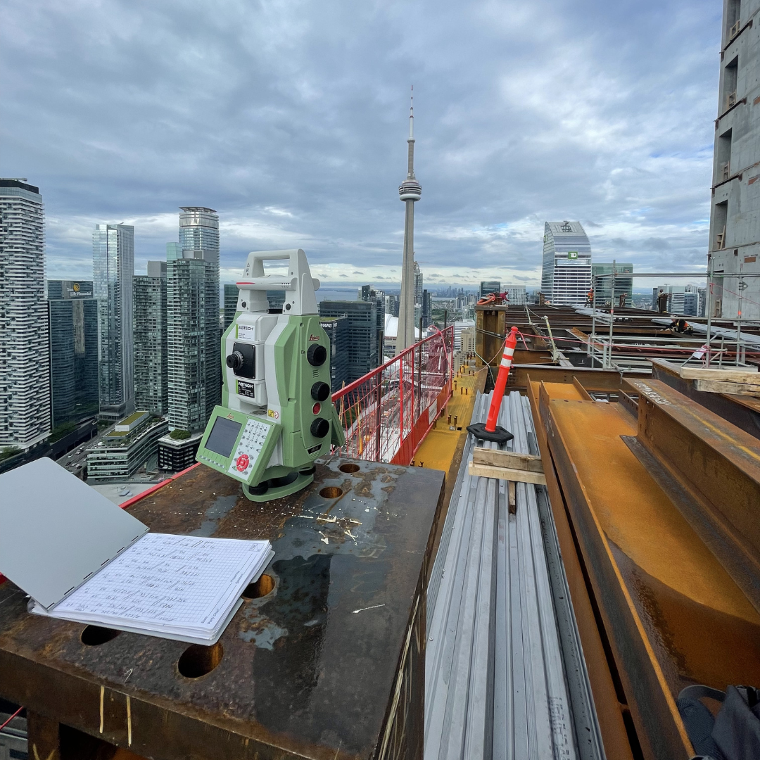 Survey equipment and construction work at CIBC Square in Toronto.