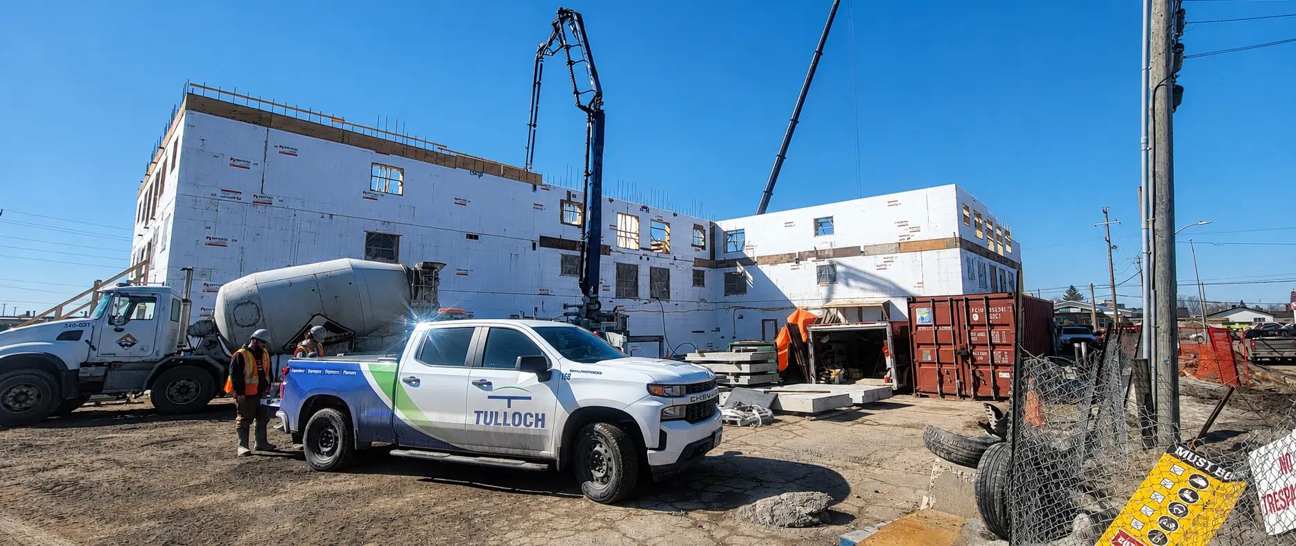 TULLOCH company truck at an active industrial construction site.