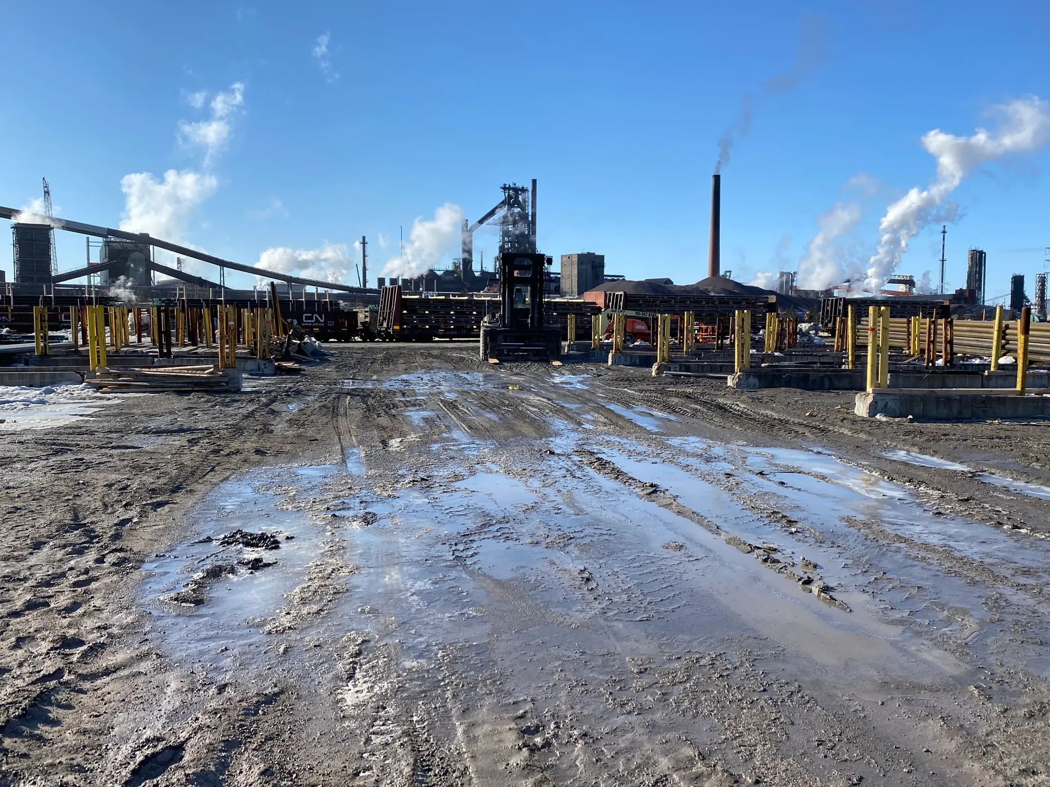 Industrial site conditions at a Tenaris tube mill.
