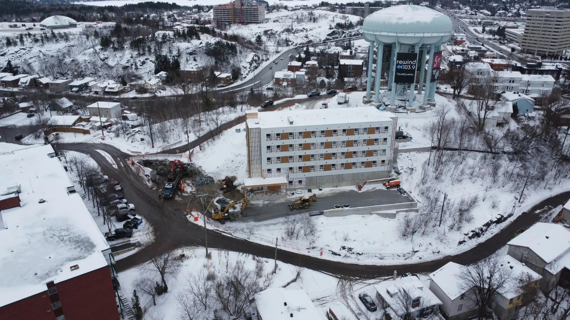 Winter aerial view of the Peace Tower site and surrounding buildings.