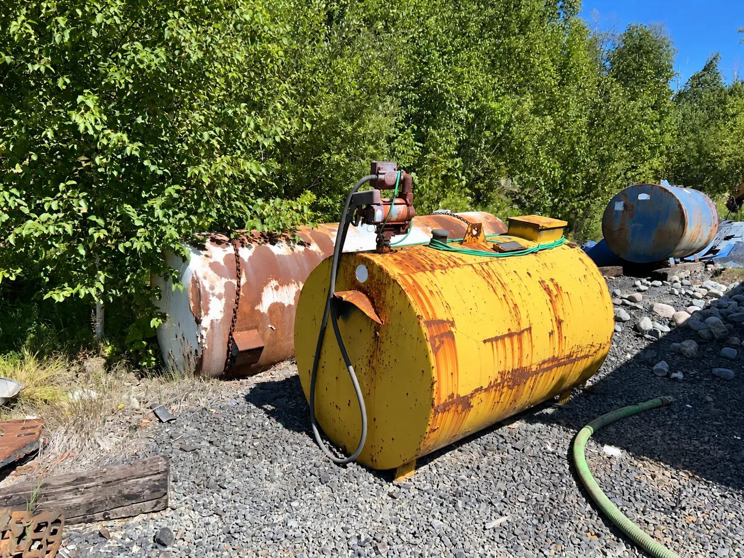 Former industrial equipment and storage area assessed during a PFAS soil investigation.