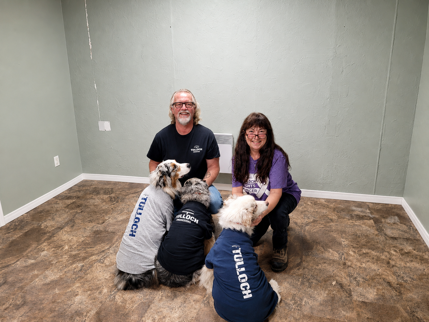 Team TULLOCH with their dogs in merch.