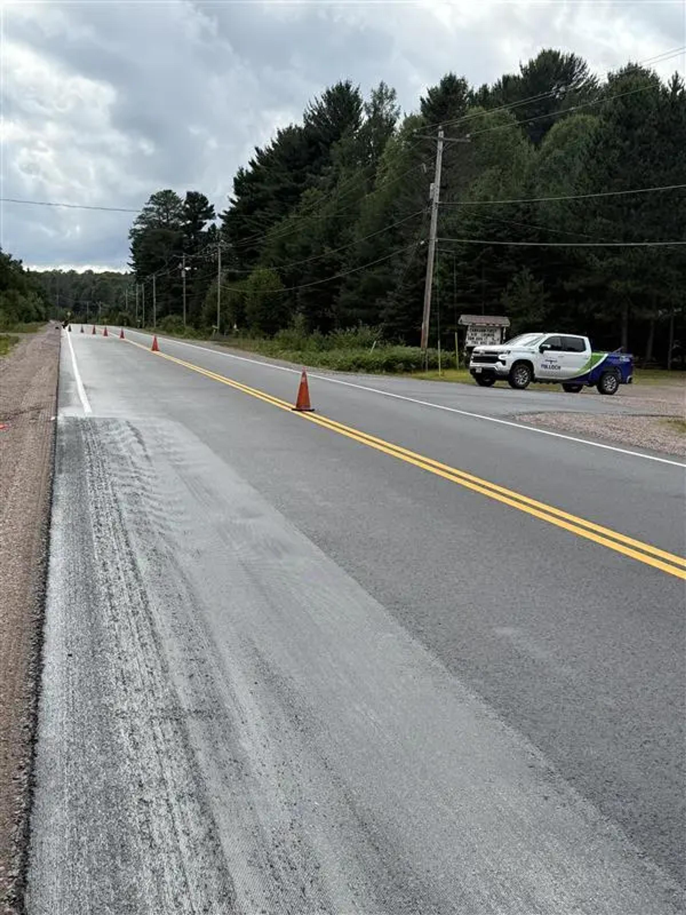Active Highway 101 construction zone during rehabilitation work near Timmins.