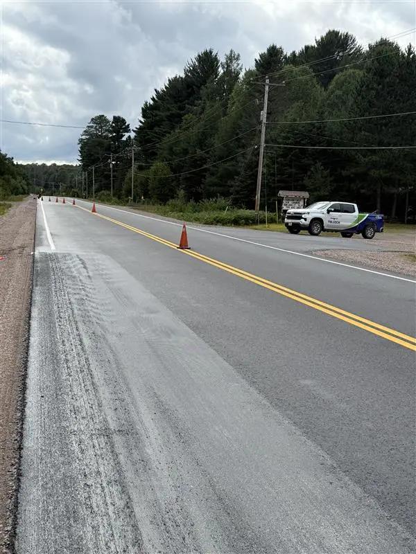 Active Highway 101 construction zone during rehabilitation work near Timmins.
